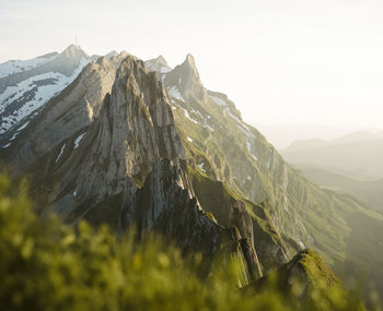 Scenic mountain view in switzerland while hiking during sunset. shot on kodak portra 400 film.