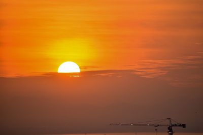 View of sea against cloudy sky during sunset