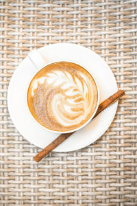 High angle view of cappuccino on table