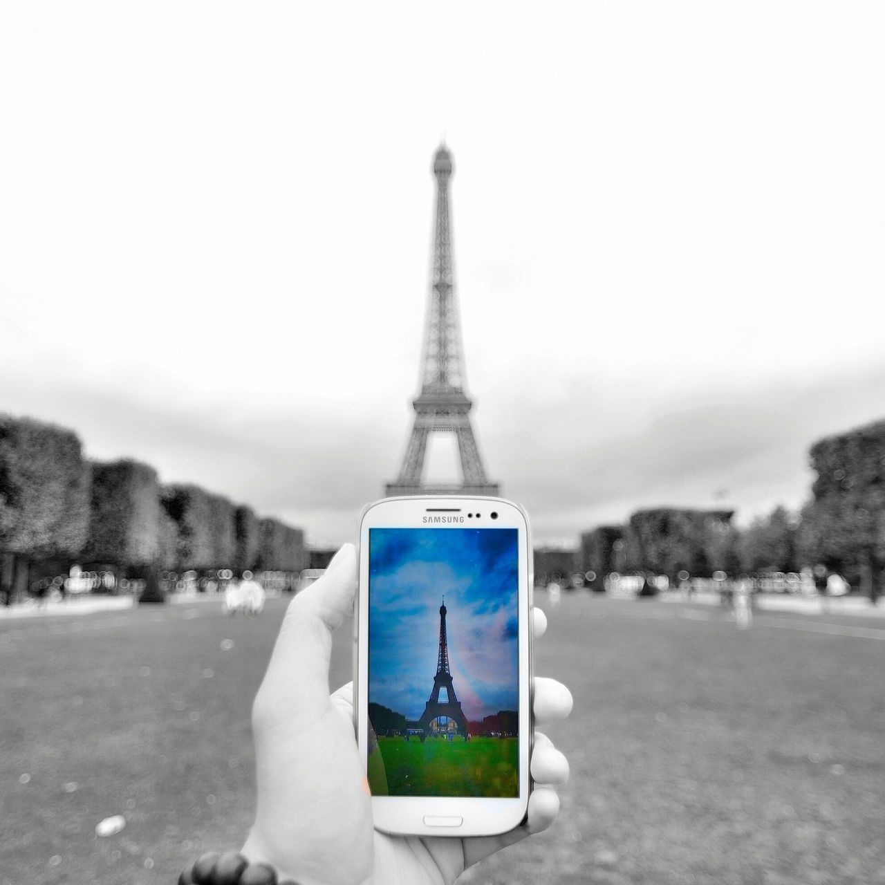 focus on foreground, metal, tourism, eiffel tower, sky, built structure, travel destinations, day, international landmark, clear sky, famous place, communication, close-up, incidental people, outdoors, architecture, travel, tower, metallic