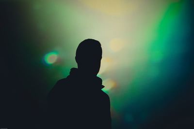 Silhouette of woman at night