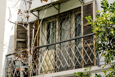 Low angle view of building seen through window