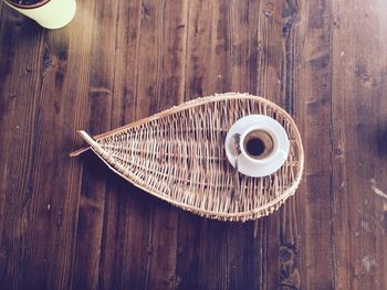Close-up of coffee cup on wooden table