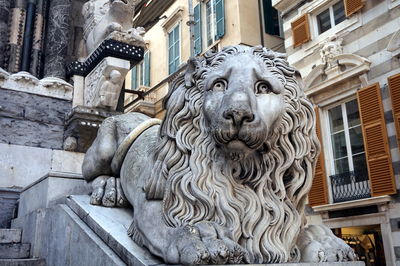 Low angle view of statue against building