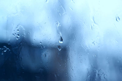 Full frame shot of wet glass window