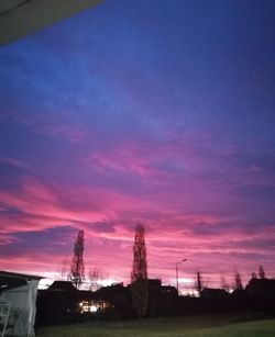 Silhouette buildings against sky during sunset