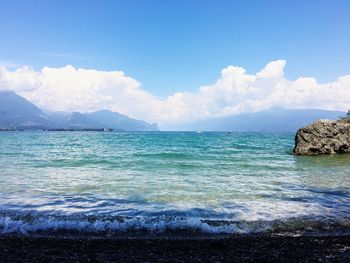 Scenic view of sea against cloudy sky