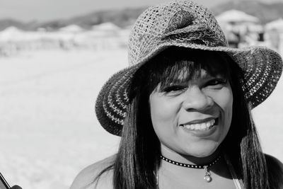 Portrait of smiling woman wearing hat