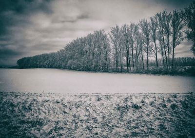 Scenic view of snow covered landscape against sky