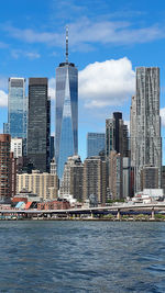 Buildings in city against sky