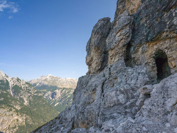 Low angle view of rock formation against clear sky