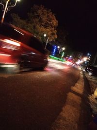 Blurred motion of car on street at night