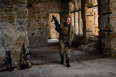 Full length of man standing against old ruins