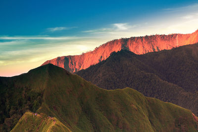 Scenic view of mountains against sky during sunset