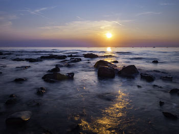 Scenic view of sea against sky during sunset