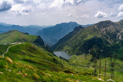 Scenic view of landscape and mountains against sky