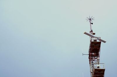 Low angle view of communications tower against clear sky