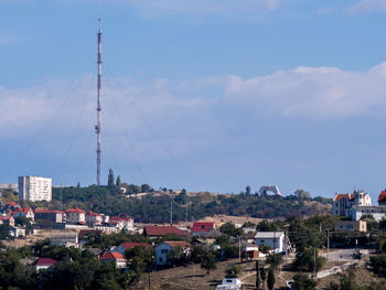 View of city against cloudy sky