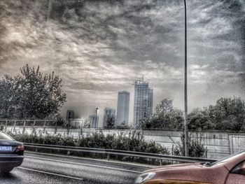 View of city against cloudy sky