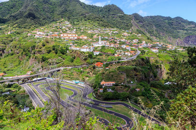 High angle view of townscape by road in village