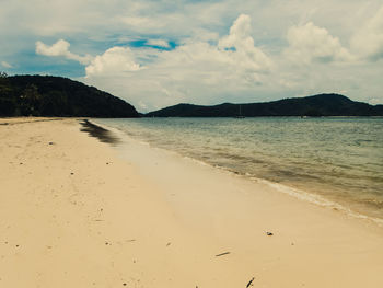 Scenic view of beach against sky