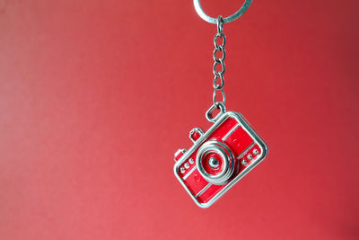 Close-up of heart shape decoration on red wall