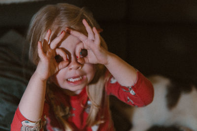 Little girl with hand eye mask