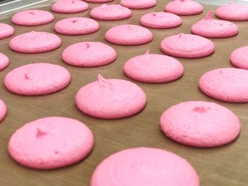 High angle view of pink candies on table