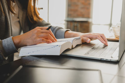 Man using laptop on table