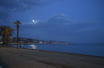 Scenic view of sea against sky at night