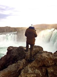 Man standing on cliff