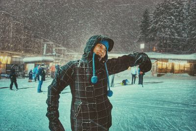 Woman standing in snow