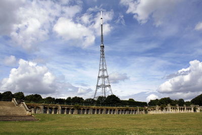 Low angle view of electricity pylon against sky