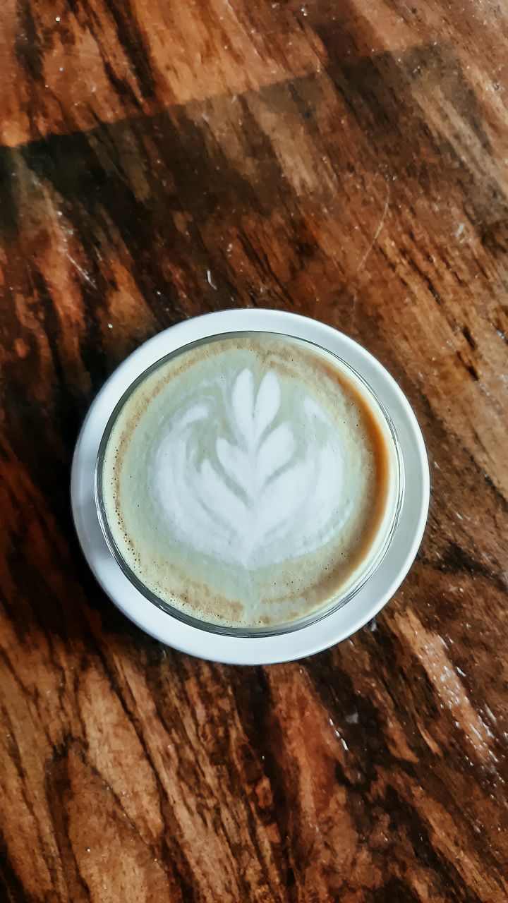 CLOSE-UP OF CAPPUCCINO ON TABLE