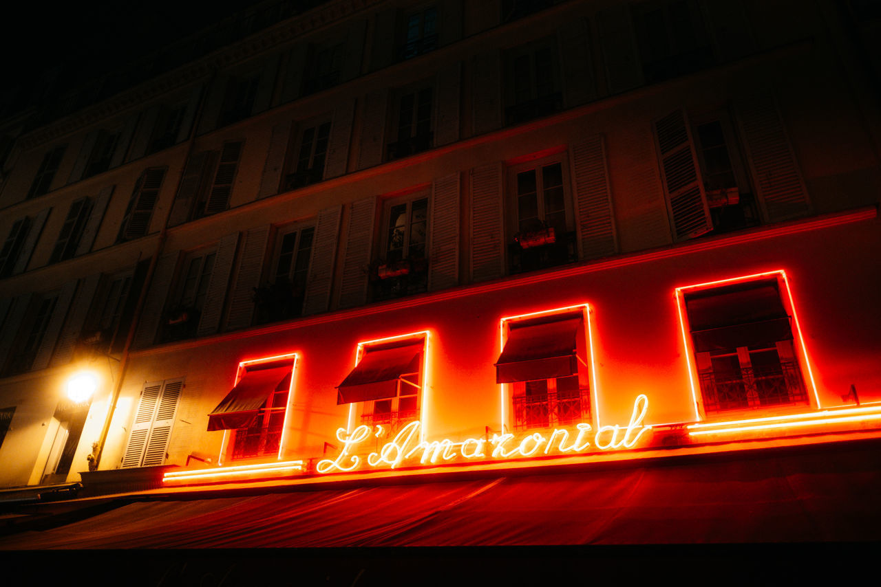 ILLUMINATED BUILDING AT NIGHT IN CITY