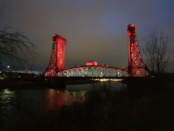 Low angle view of illuminated ferris wheel at night