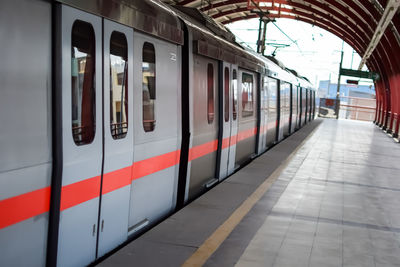 Delhi metro train arriving at jhandewalan metro station in new delhi, india,asia, public metro train