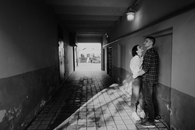 People walking in corridor of building