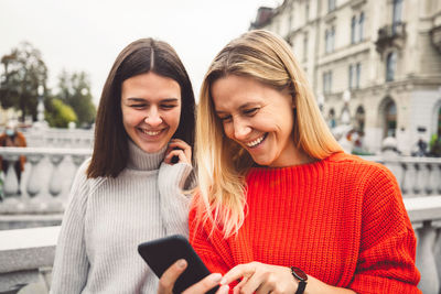 Young woman using mobile phone