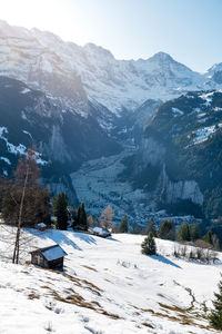 Scenic view of snow covered mountains against sky