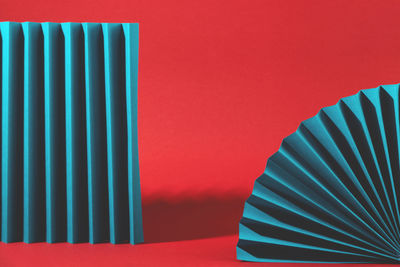 Minimalistic retro scene with geometric shapes on red background. empty space for product.