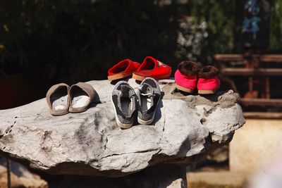 Close-up of shoes on rock