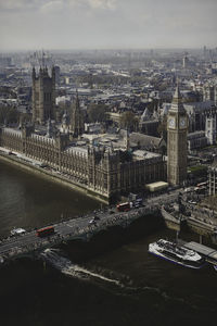 Uk parliament with big ben and the double-decker on westminster bridge