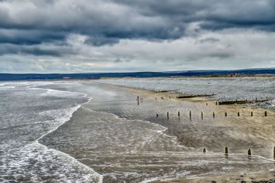 Scenic view of beach against sky