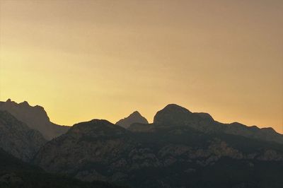 Scenic view of silhouette mountains against clear sky