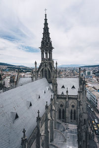 Panoramic view of buildings in city against sky