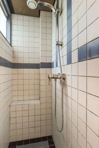 Low angle view of man standing in bathroom