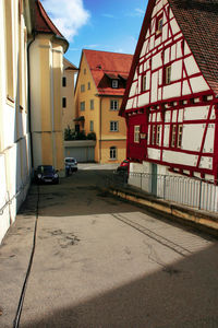 Street amidst buildings against sky