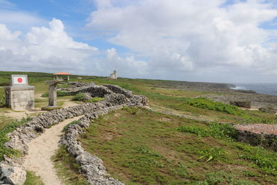 View of old ruins against cloudy sky