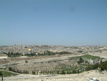 Aerial view of cityscape against clear sky